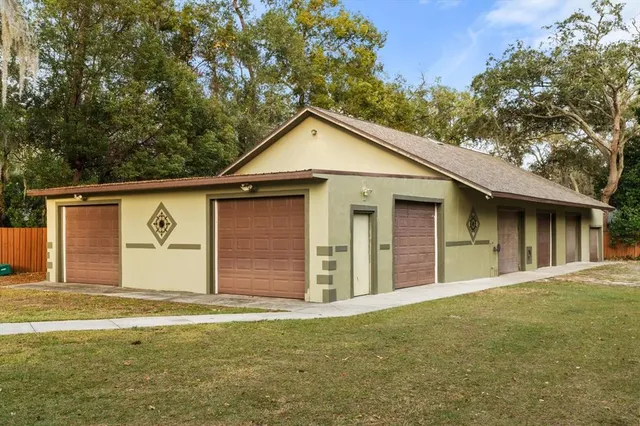 an aerial view of a residential houses with outdoor space