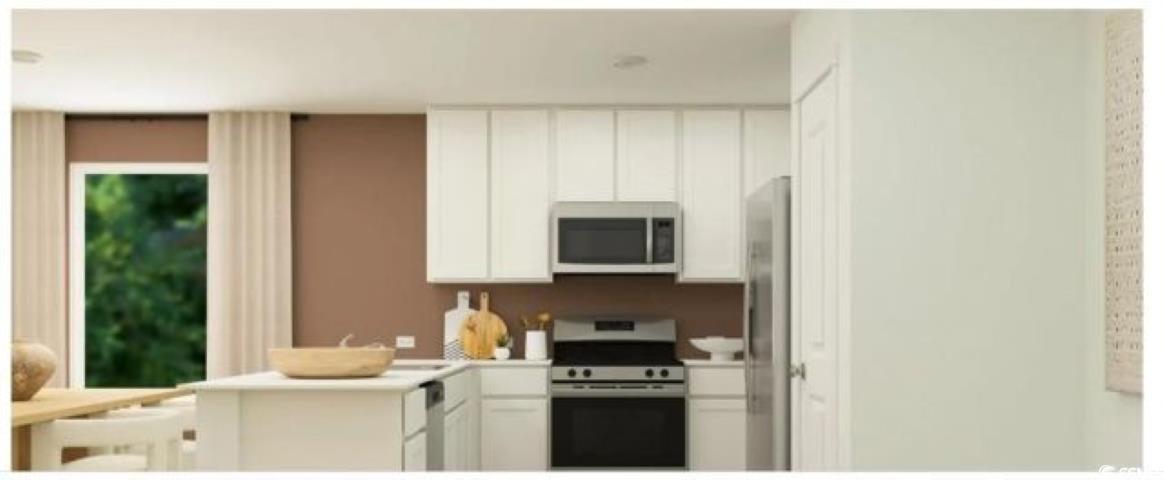 512 Runaway Train Drive Loris, SC 29569 - Photo 5 of 18 Kitchen with appliances with stainless steel finishes, white cabinets, light countertops, and a peninsula