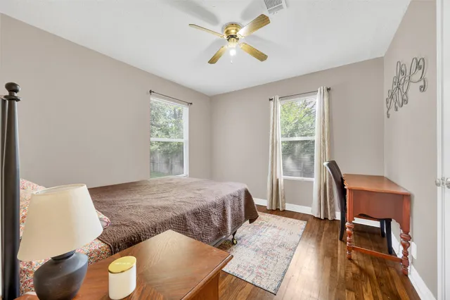 a bedroom with a bed and a table with closet