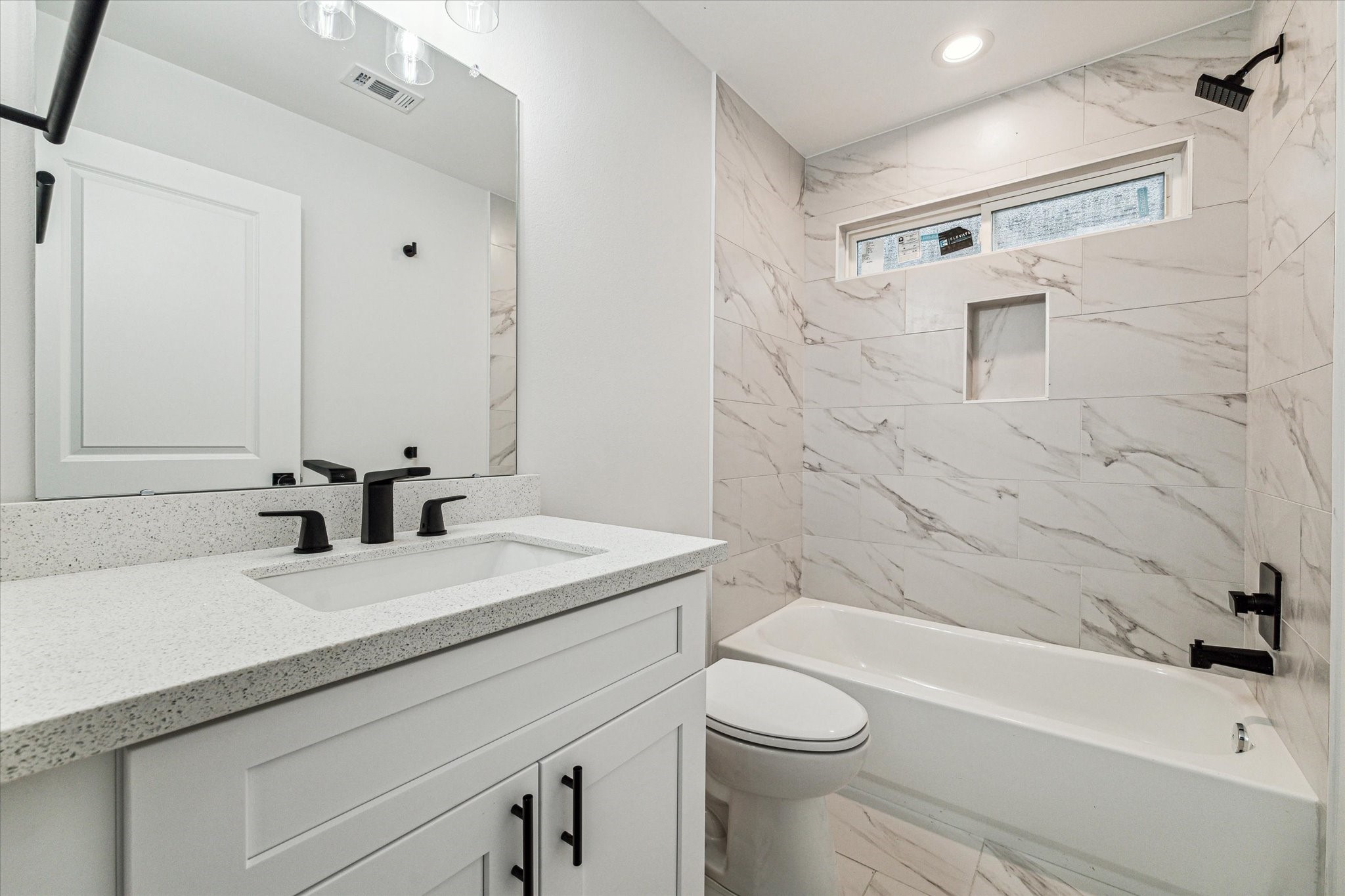 976 Marjorie Street, Unit 2 Houston, TX 77088 - Photo 11 of 11 a bathroom with a sink a toilet and shower