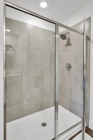 a bathroom with a shower and toilet