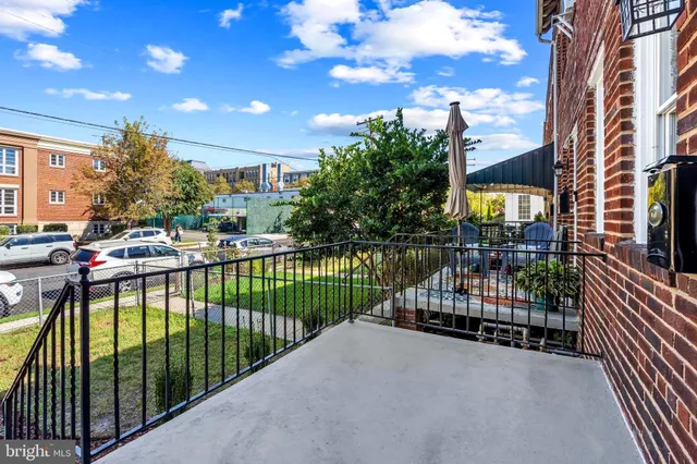 a view of street from balcony