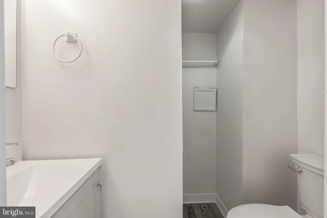 a bathroom with a sink toilet and vanity