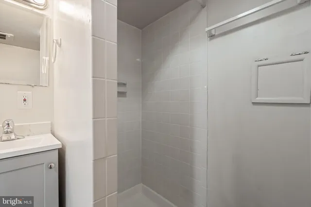 a bathroom with a sink and mirror