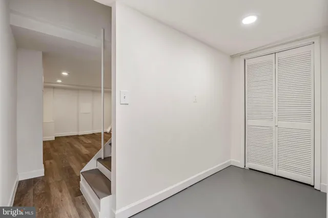 an entryway and livingroom with furniture