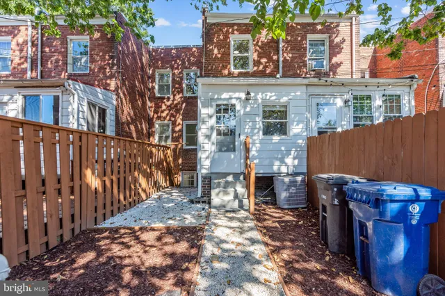 a view of a brick building with many windows