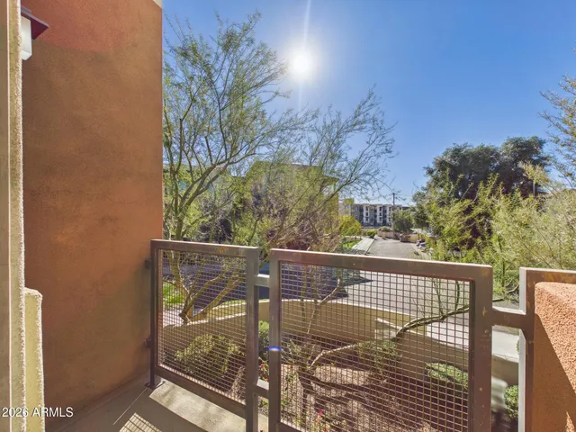 a view of balcony with wooden floor