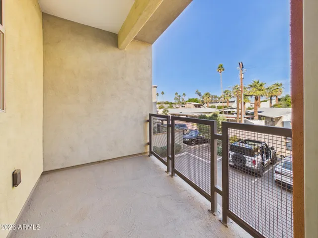 a view of a bedroom with a bed and furniture