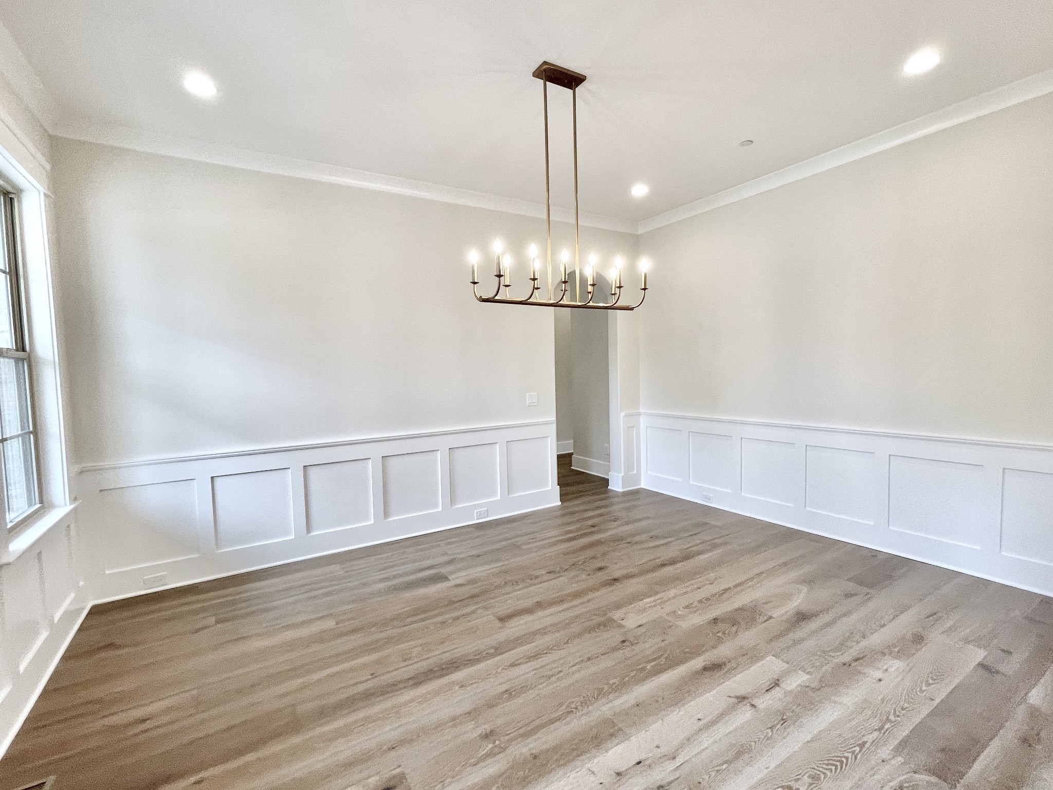 9926 Maupin Road Brentwood, TN 37027 - Photo 12 of 88 a view of an empty room with wooden floor and a window