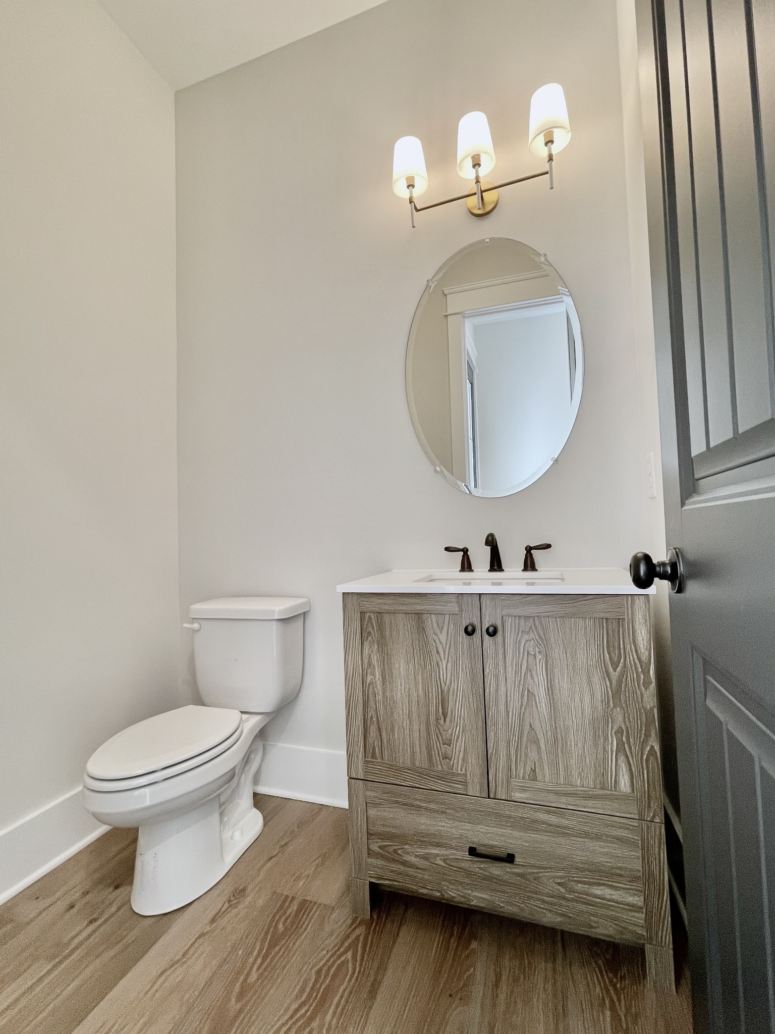 9926 Maupin Road Brentwood, TN 37027 - Photo 15 of 88 a bathroom with a sink a toilet and mirror