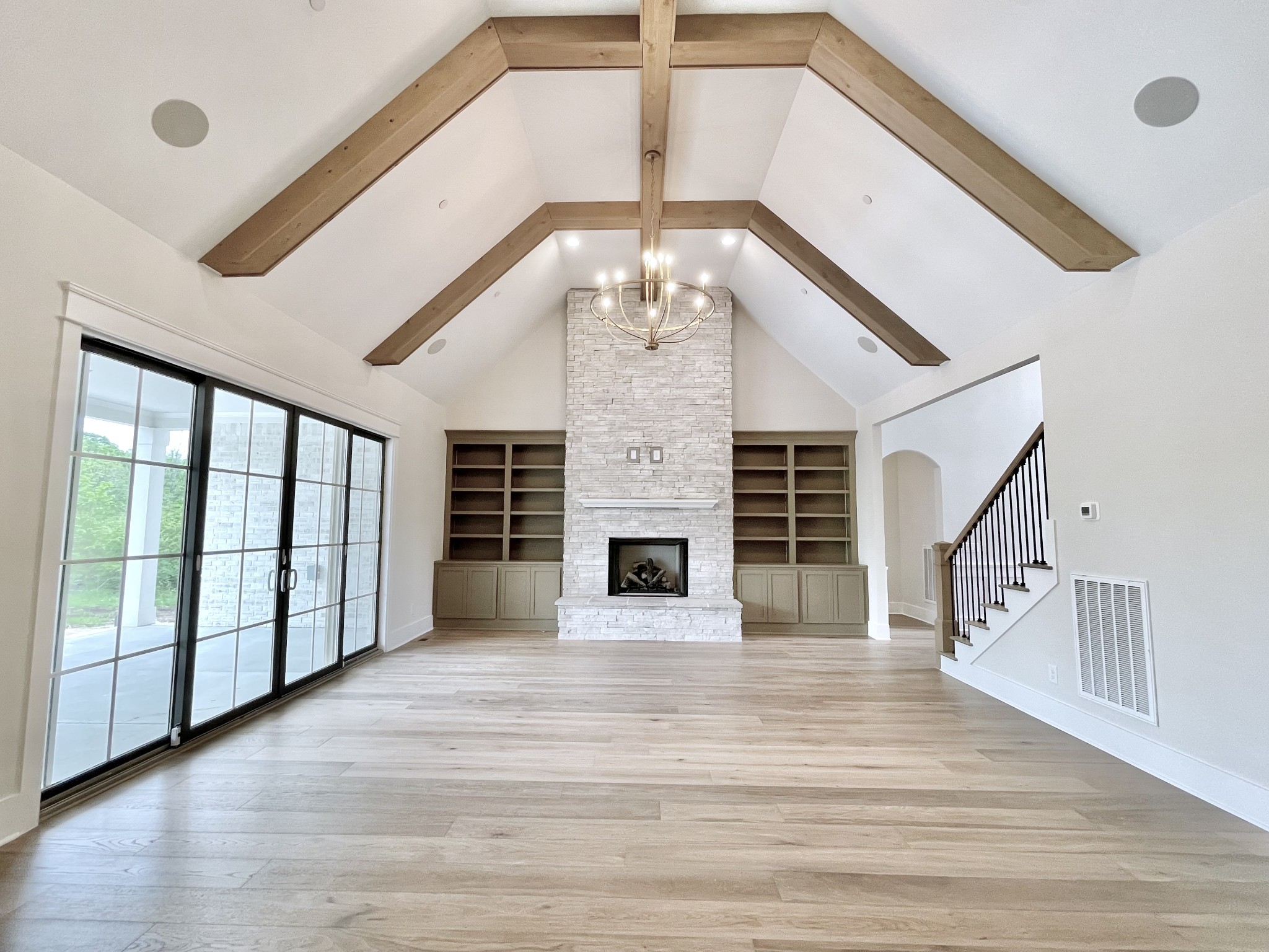 9926 Maupin Road Brentwood, TN 37027 - Photo 29 of 88 a view of an empty room with wooden floor fireplace and a window