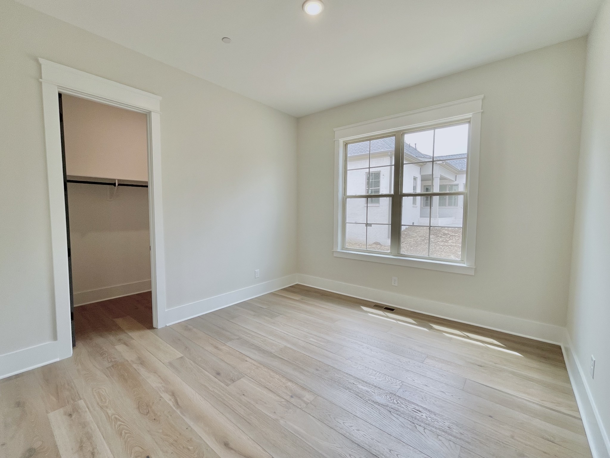 9926 Maupin Road Brentwood, TN 37027 - Photo 38 of 88 an empty room with wooden floor cabinet and windows