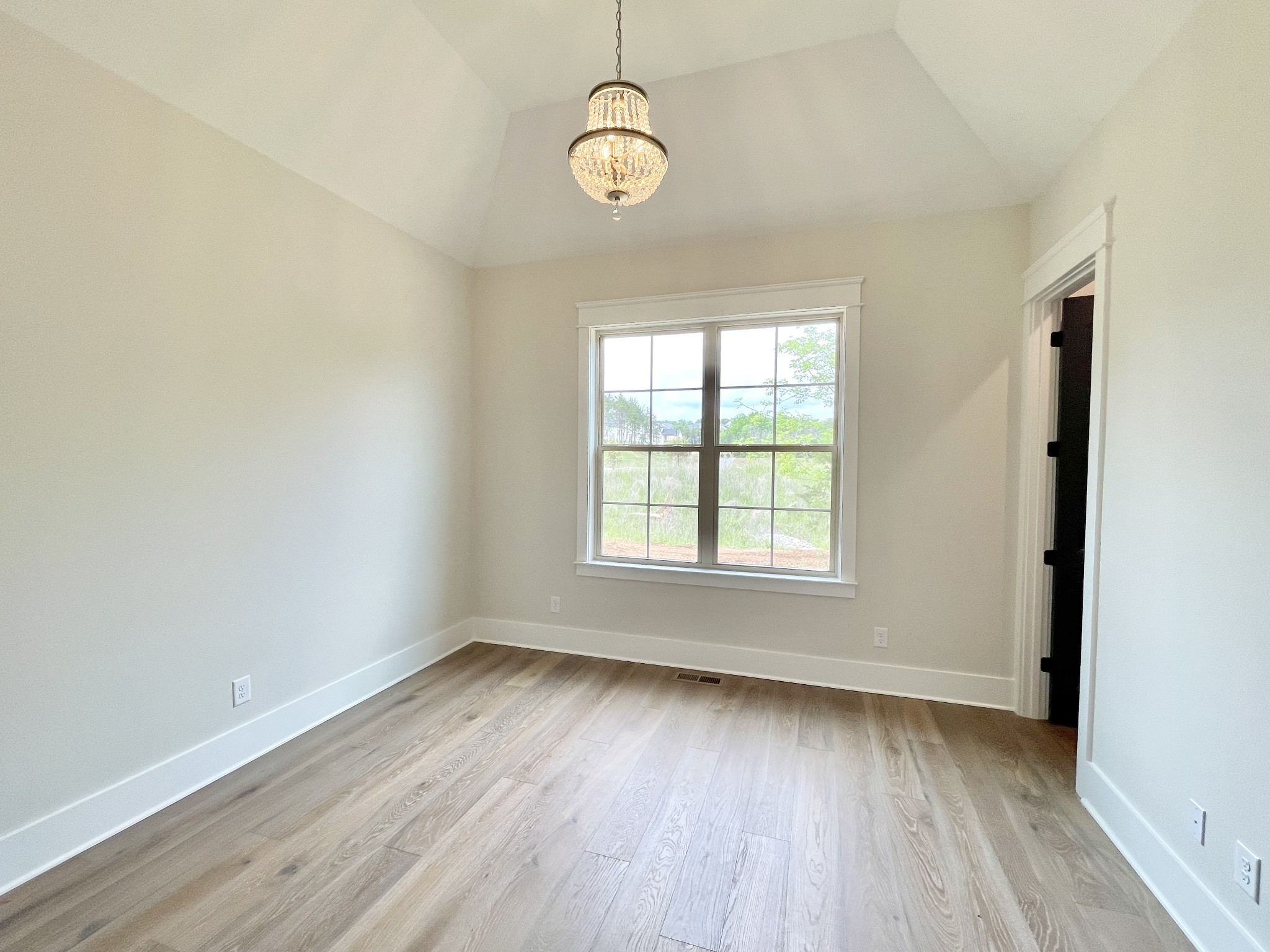9926 Maupin Road Brentwood, TN 37027 - Photo 44 of 88 an empty room with wooden floor and windows