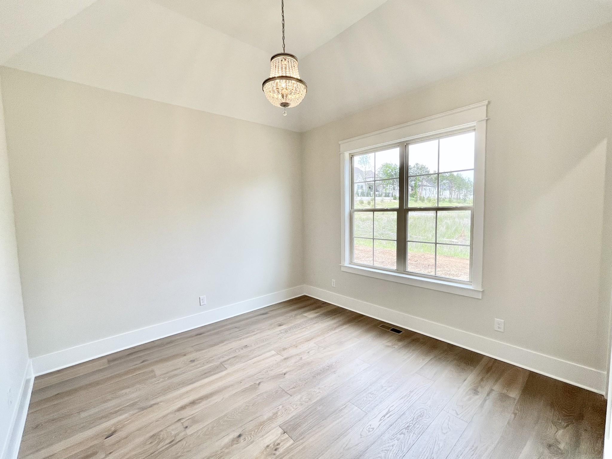 9926 Maupin Road Brentwood, TN 37027 - Photo 46 of 88 an empty room with wooden floor and windows