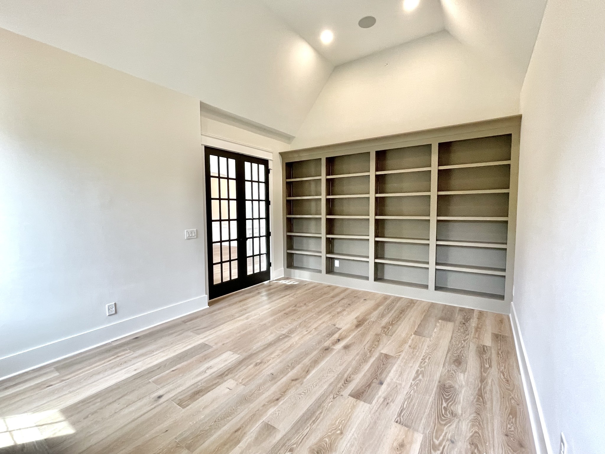 9926 Maupin Road Brentwood, TN 37027 - Photo 6 of 88 a view of an empty room with a window and a dresser