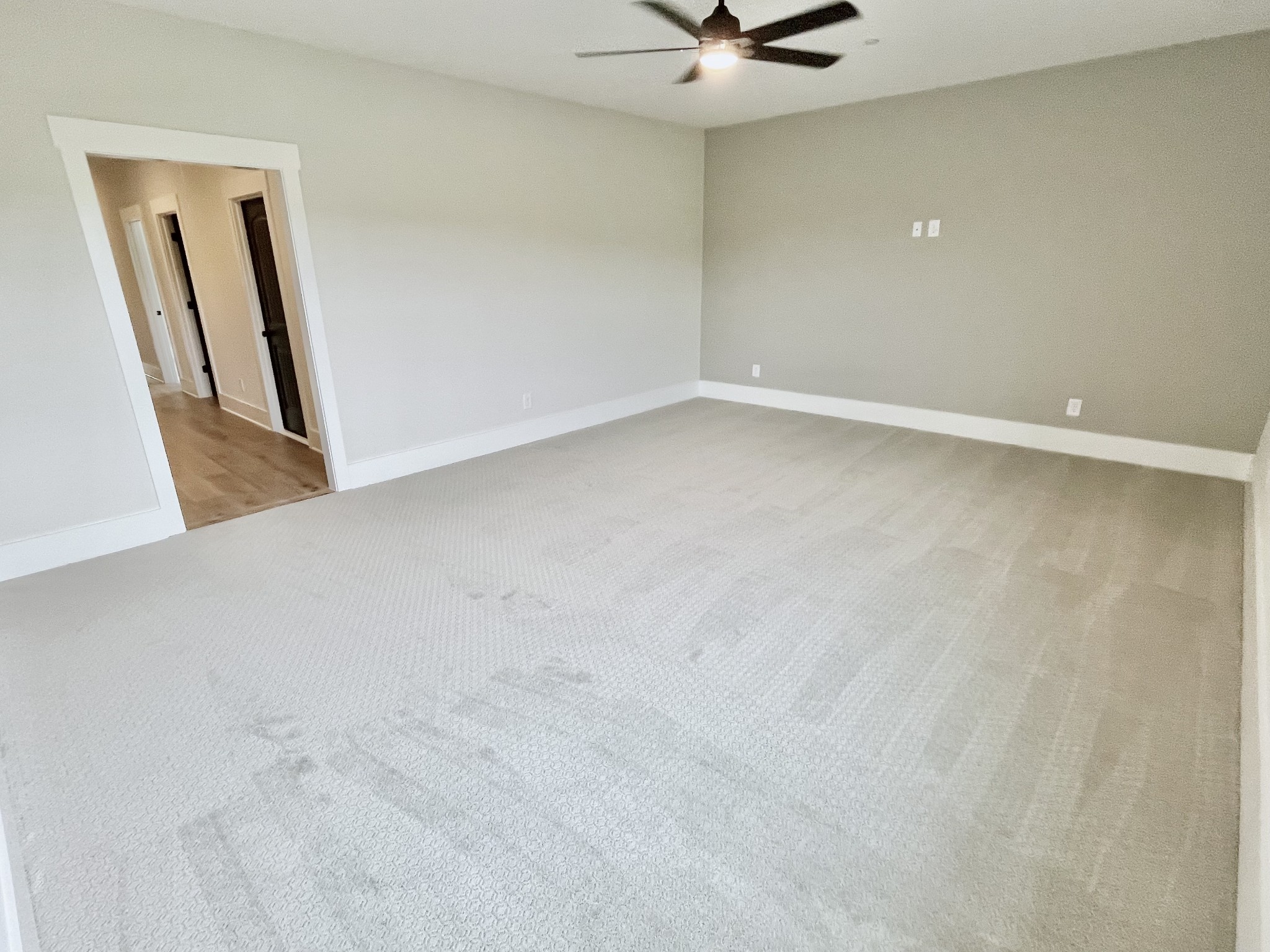 9926 Maupin Road Brentwood, TN 37027 - Photo 63 of 88 an empty room with a mirror and a ceiling fan