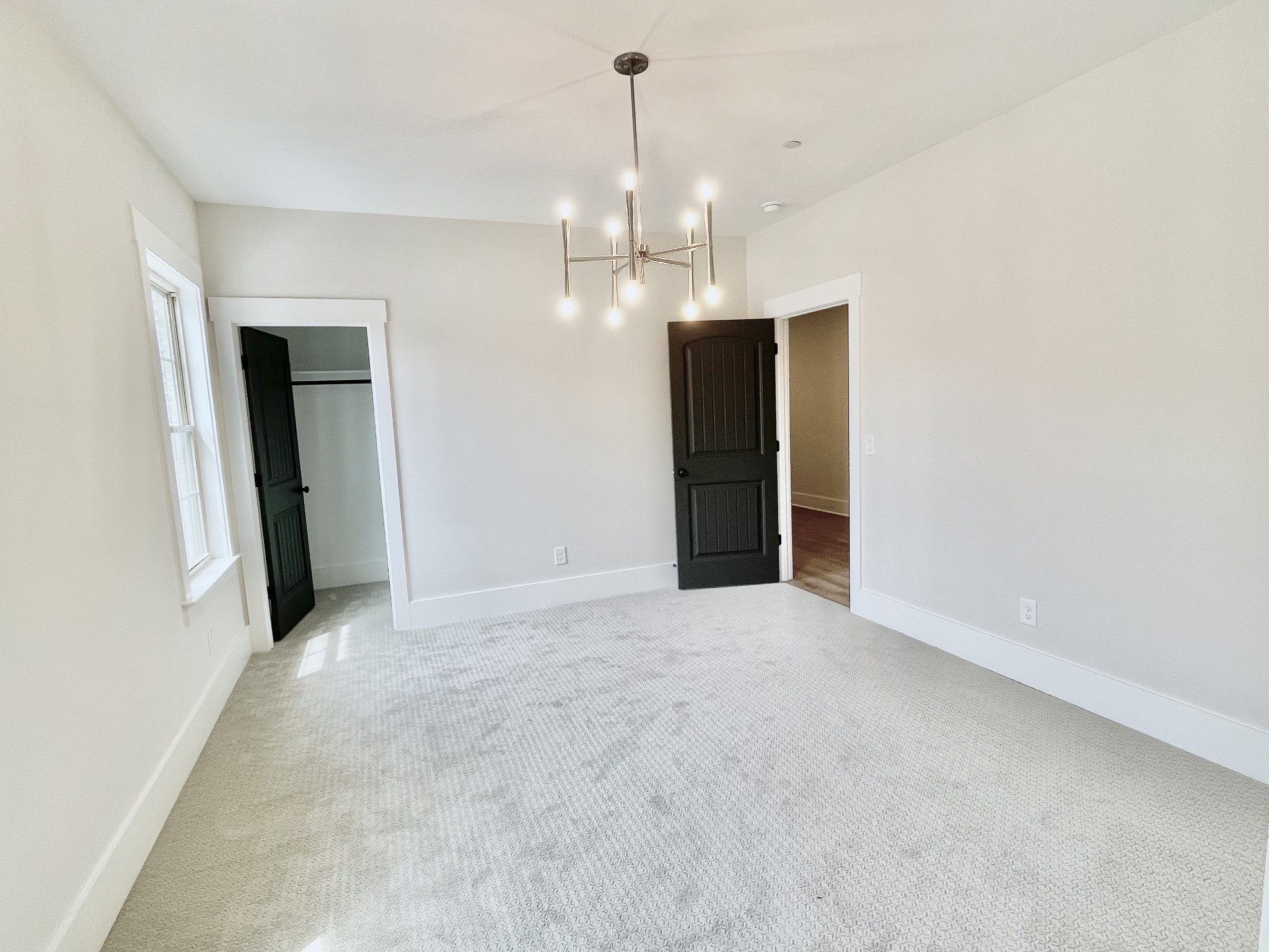 9926 Maupin Road Brentwood, TN 37027 - Photo 67 of 88 an empty room with chandelier fan and kitchen view