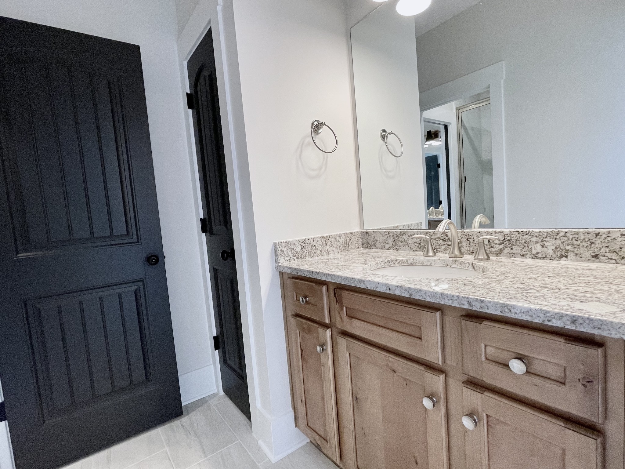 9926 Maupin Road Brentwood, TN 37027 - Photo 69 of 88 a bathroom with a granite countertop sink and a mirror