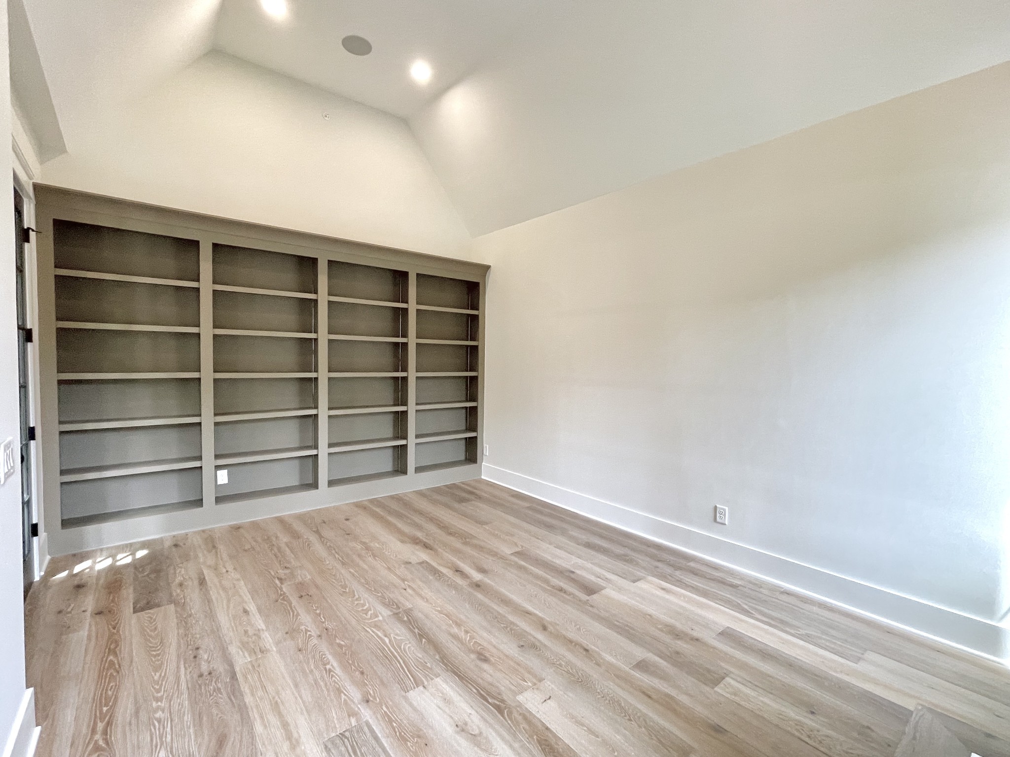 9926 Maupin Road Brentwood, TN 37027 - Photo 7 of 88 a view of an empty room with a wooden floor and a window