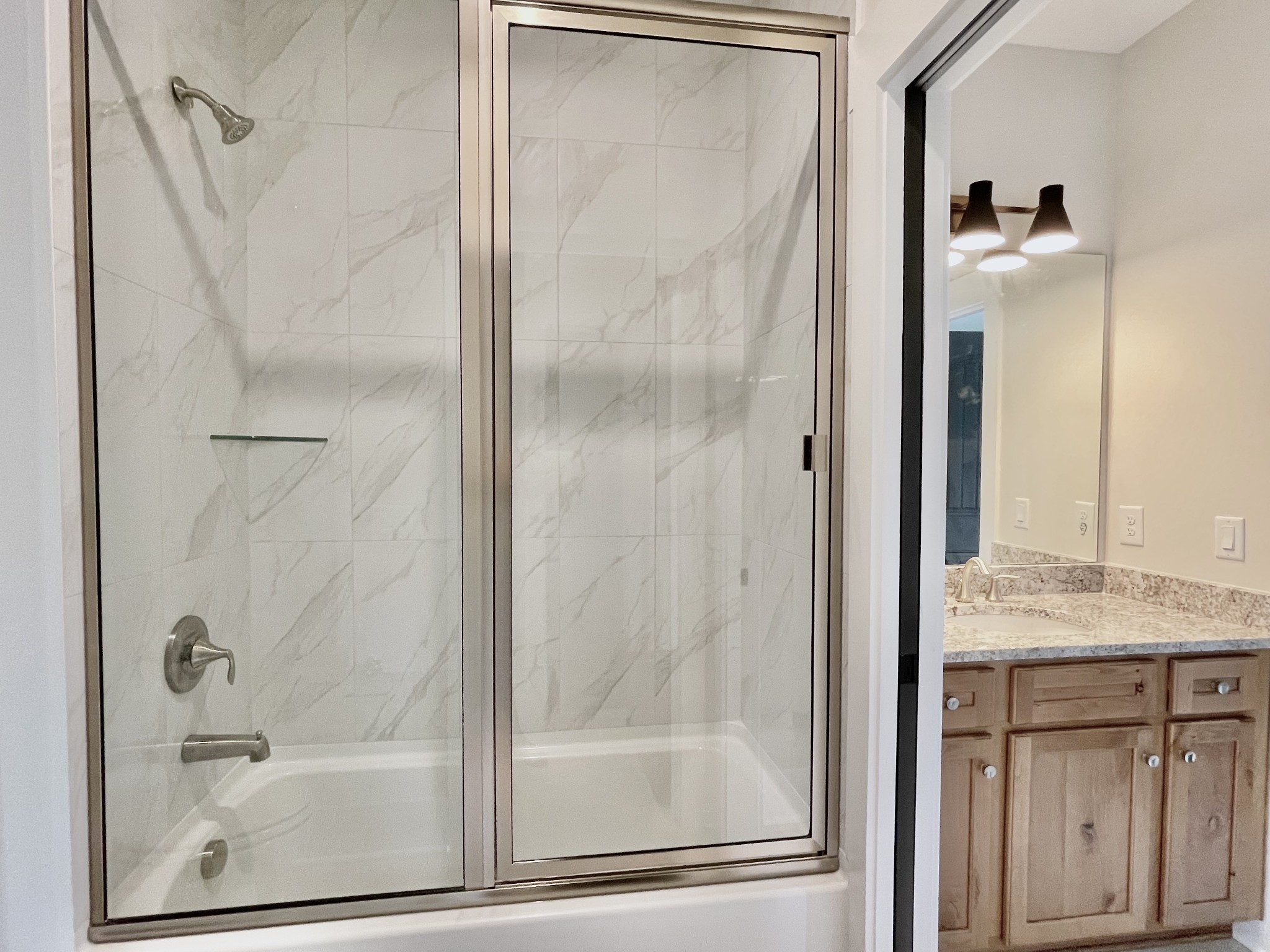 9926 Maupin Road Brentwood, TN 37027 - Photo 71 of 88 a bathroom with a granite countertop shower and a sink