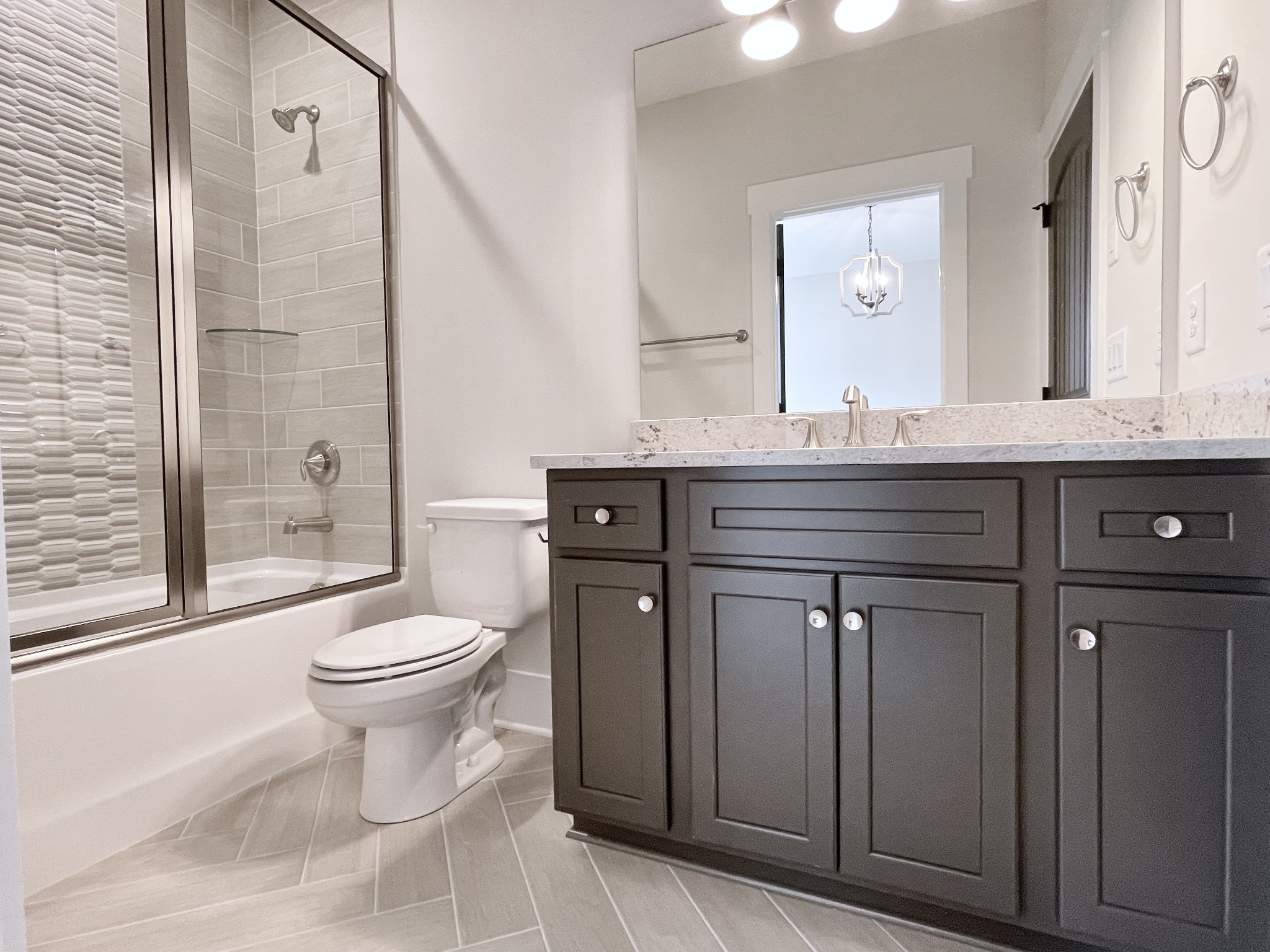 9926 Maupin Road Brentwood, TN 37027 - Photo 77 of 88 a bathroom with a toilet a sink and a large mirror