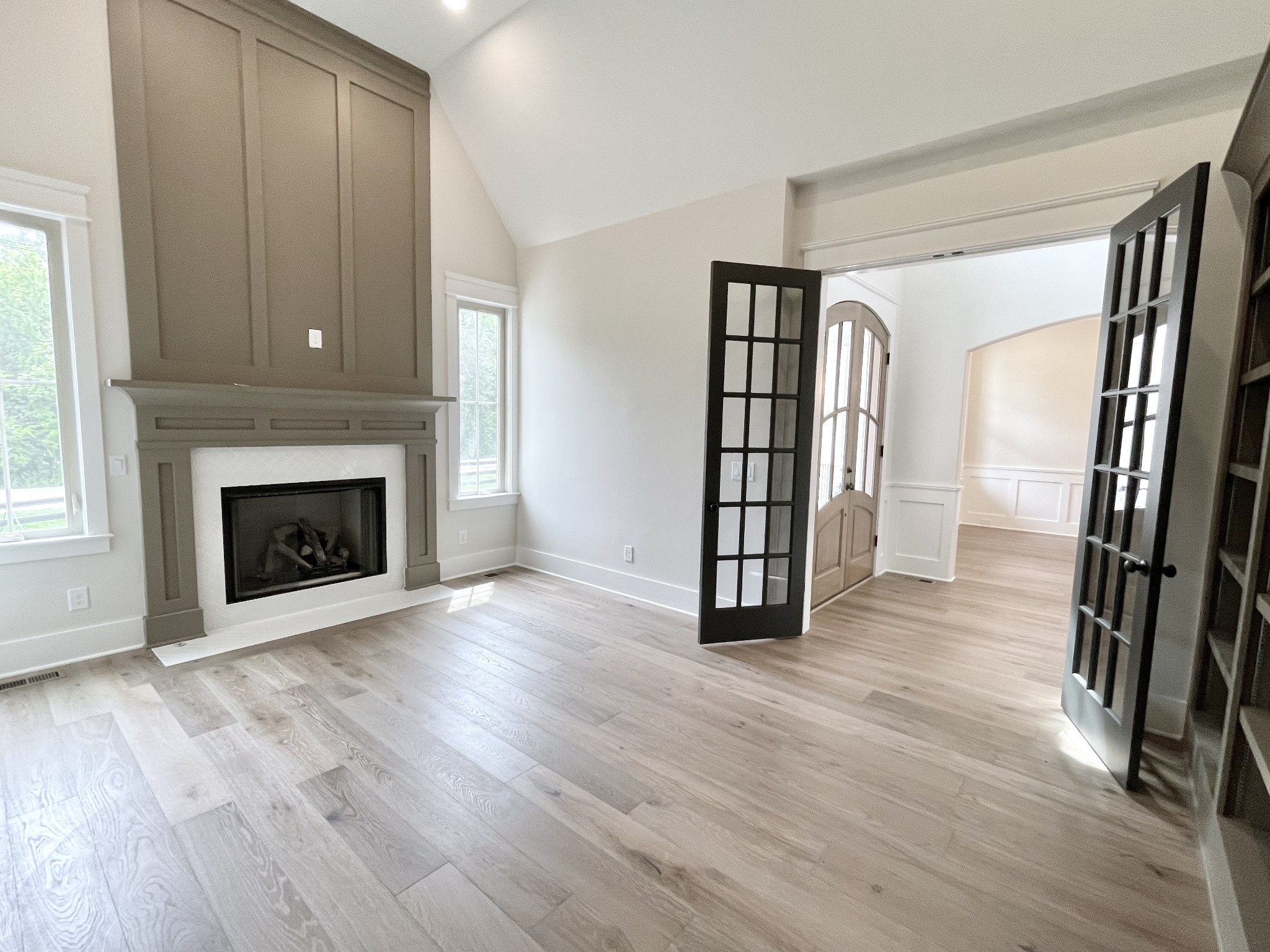 9926 Maupin Road Brentwood, TN 37027 - Photo 8 of 88 an empty room with wooden floor and fireplace