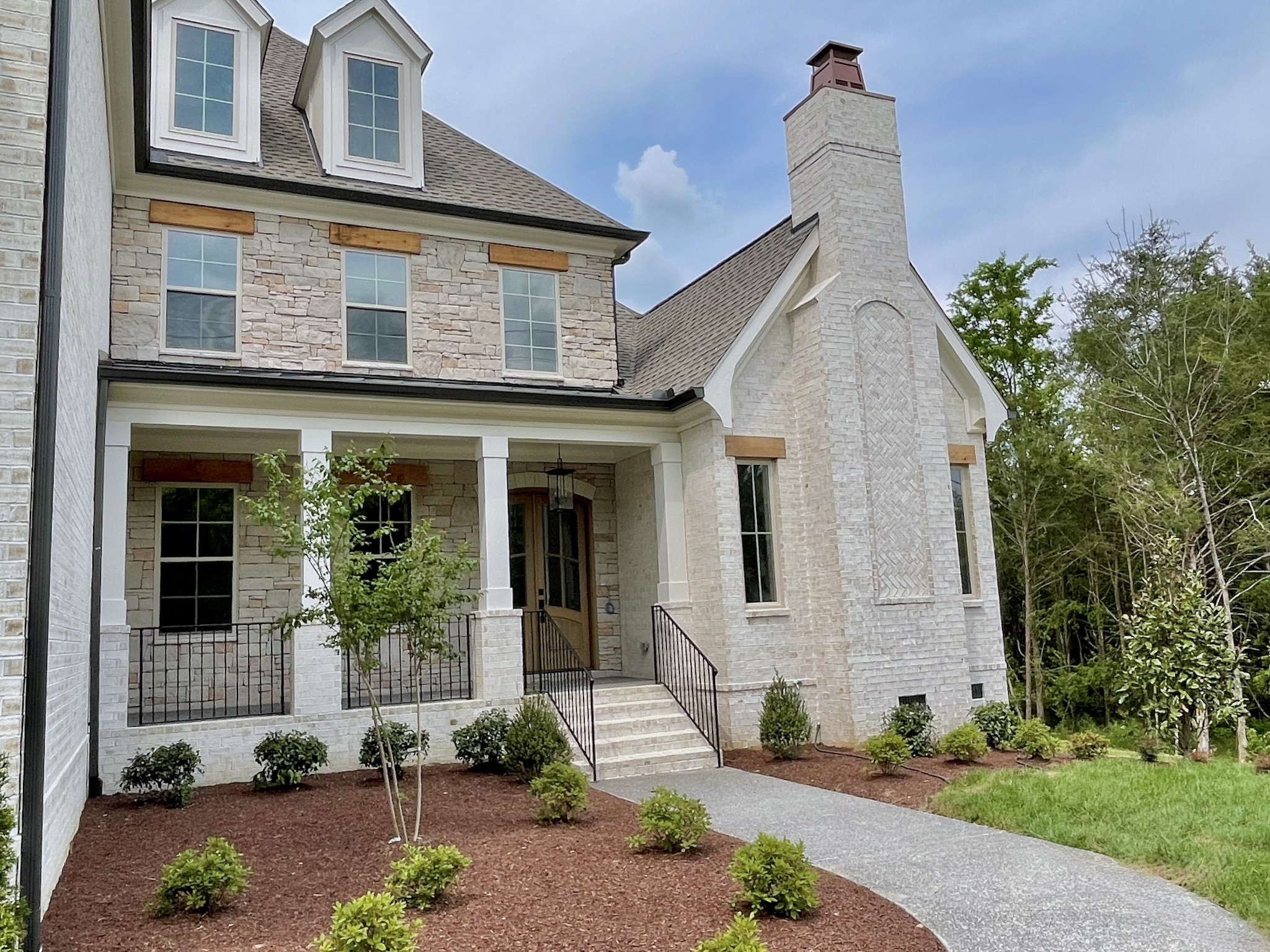 9926 Maupin Road Brentwood, TN 37027 - Photo 84 of 88 a front view of a house with garden