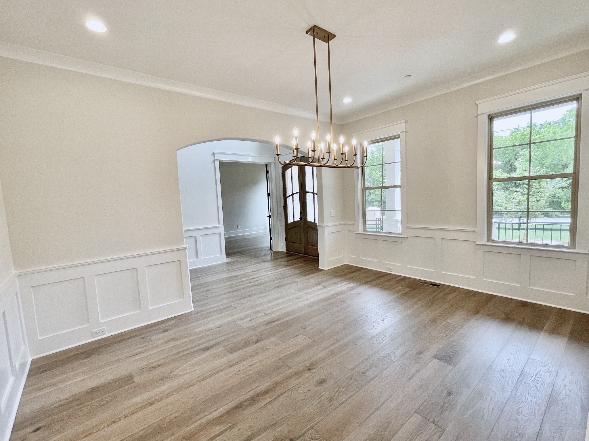9926 Maupin Road Brentwood, TN 37027 - Photo 9 of 88 a view of an empty room with wooden floor and a window