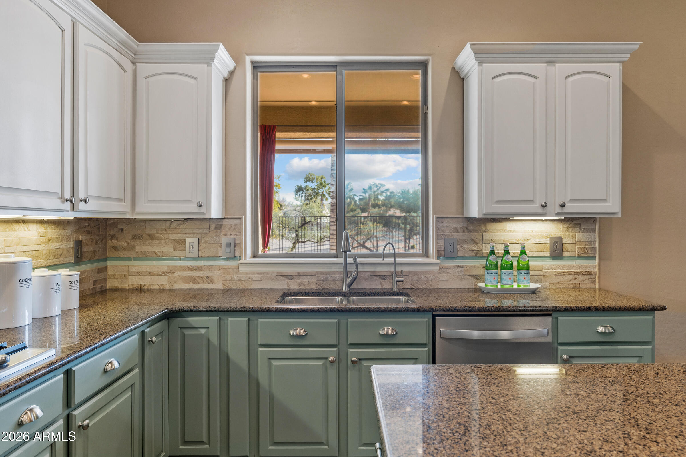 1341 East Macaw Court Gilbert, AZ 85297 - Photo 11 of 49 a kitchen with granite countertop a sink and a window