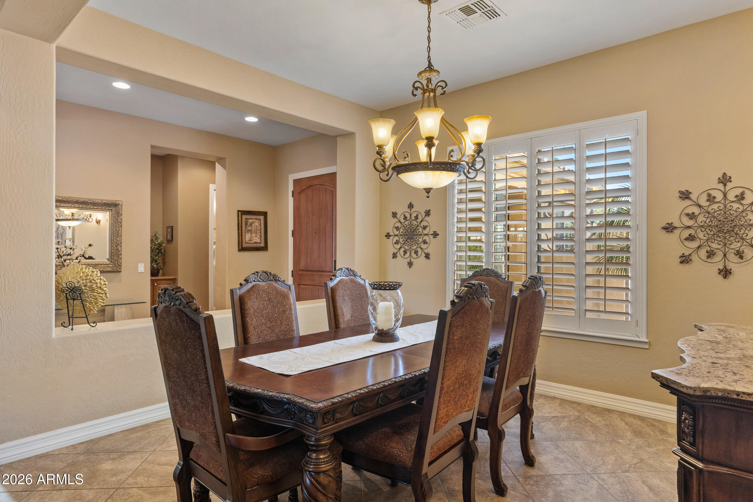 1341 East Macaw Court Gilbert, AZ 85297 - Photo 19 of 49 a view of a dining room with furniture window and outside view