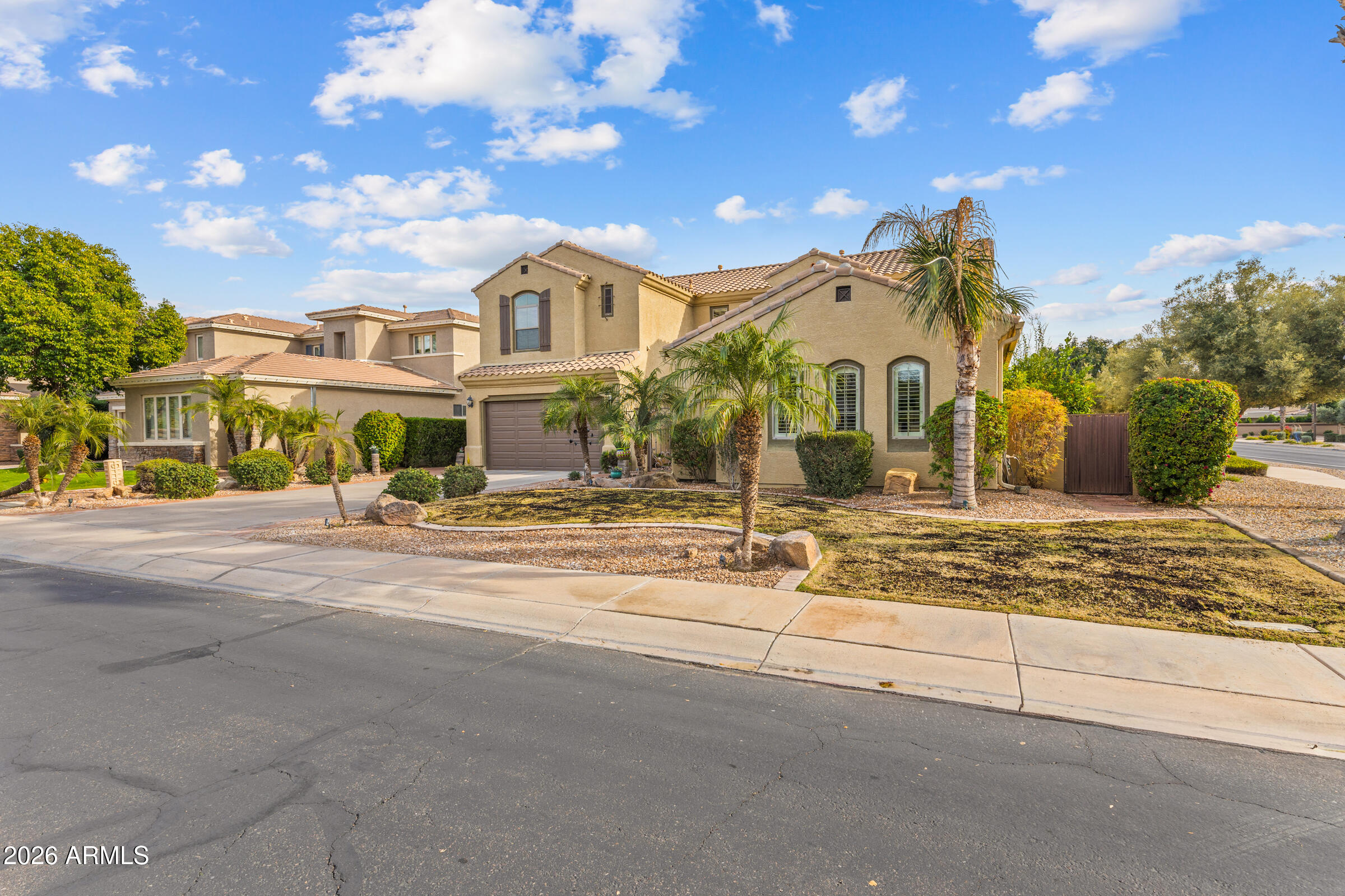 1341 East Macaw Court Gilbert, AZ 85297 - Photo 2 of 49 a front view of a house with a yard