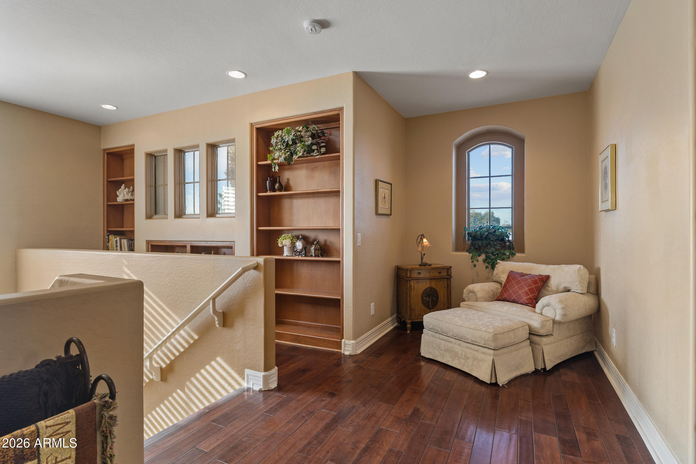 1341 East Macaw Court Gilbert, AZ 85297 - Photo 21 of 49 a living room with furniture and wooden floor