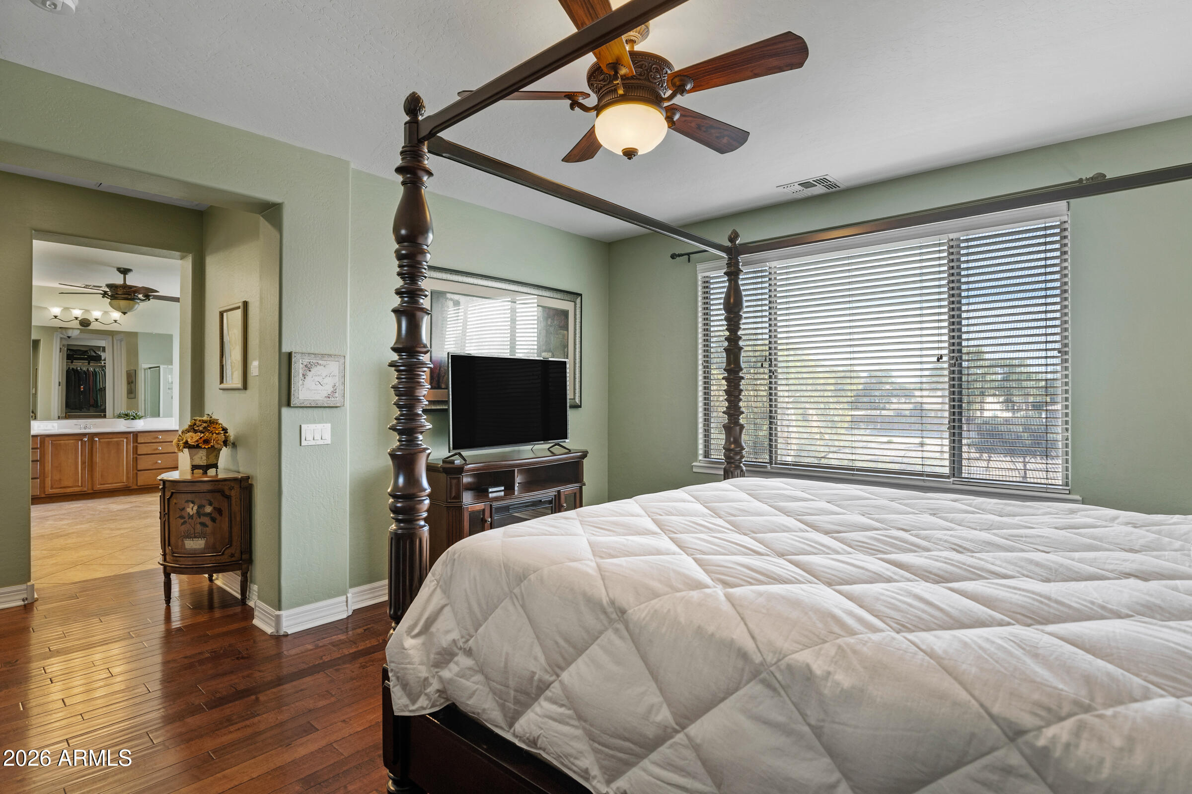 1341 East Macaw Court Gilbert, AZ 85297 - Photo 24 of 49 a bedroom with a bed and a flat screen tv