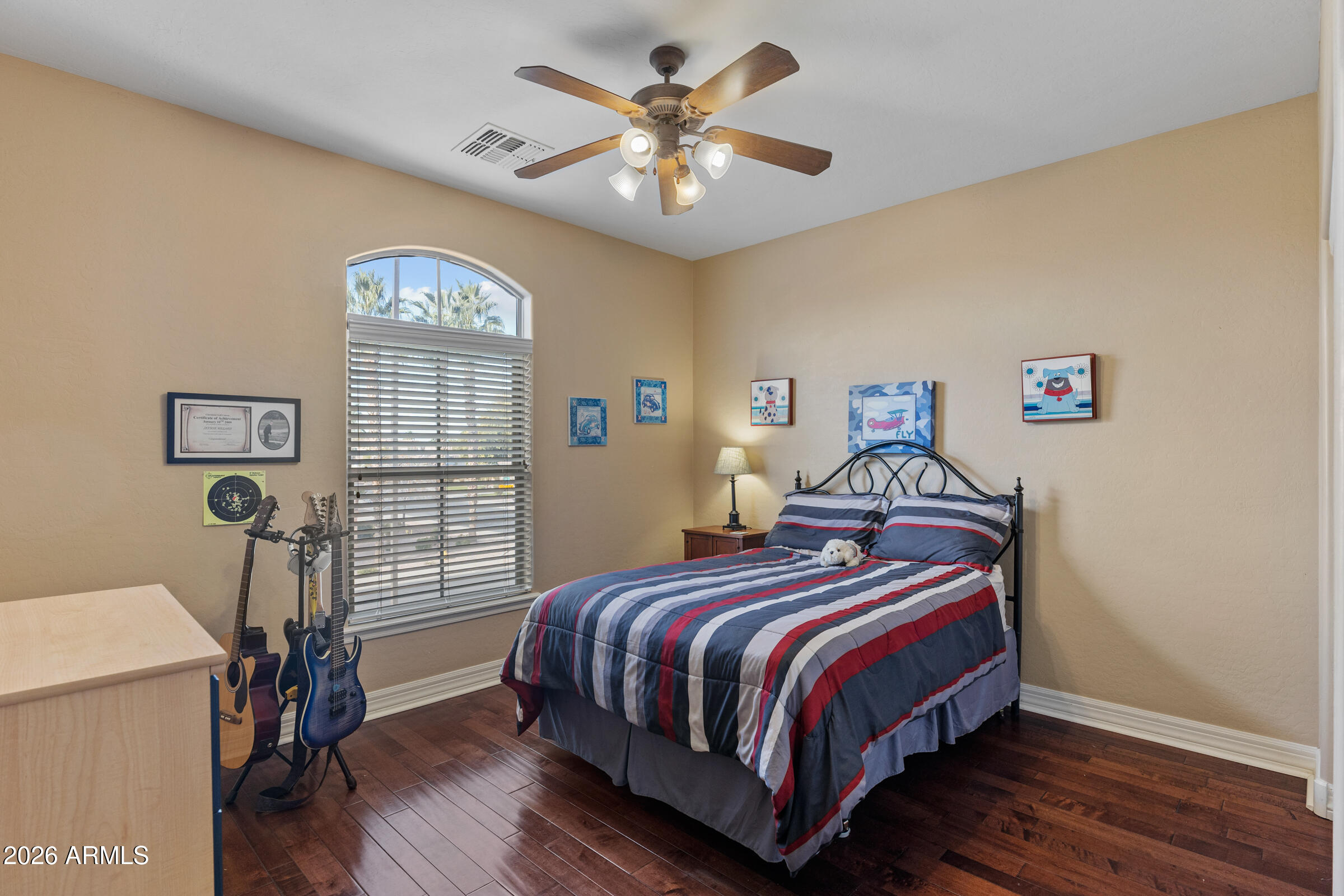 1341 East Macaw Court Gilbert, AZ 85297 - Photo 30 of 49 a bedroom with bed and a window