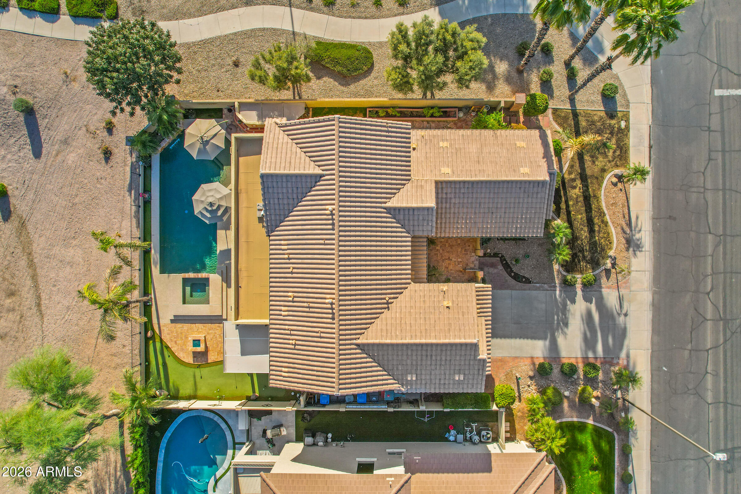 1341 East Macaw Court Gilbert, AZ 85297 - Photo 3 of 49 an aerial view of a house with a yard and balcony