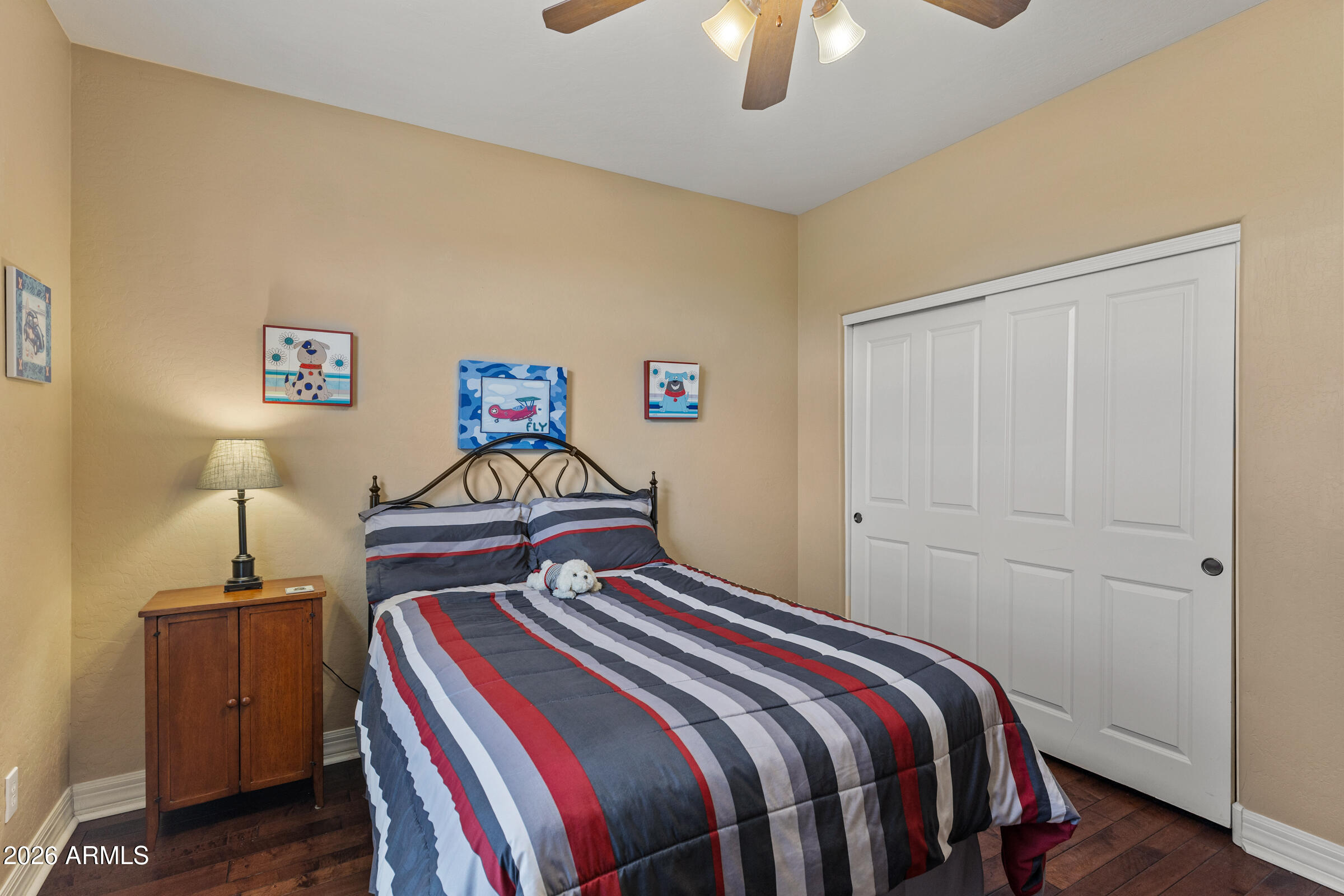 1341 East Macaw Court Gilbert, AZ 85297 - Photo 31 of 49 a bedroom with a bed and a chandelier