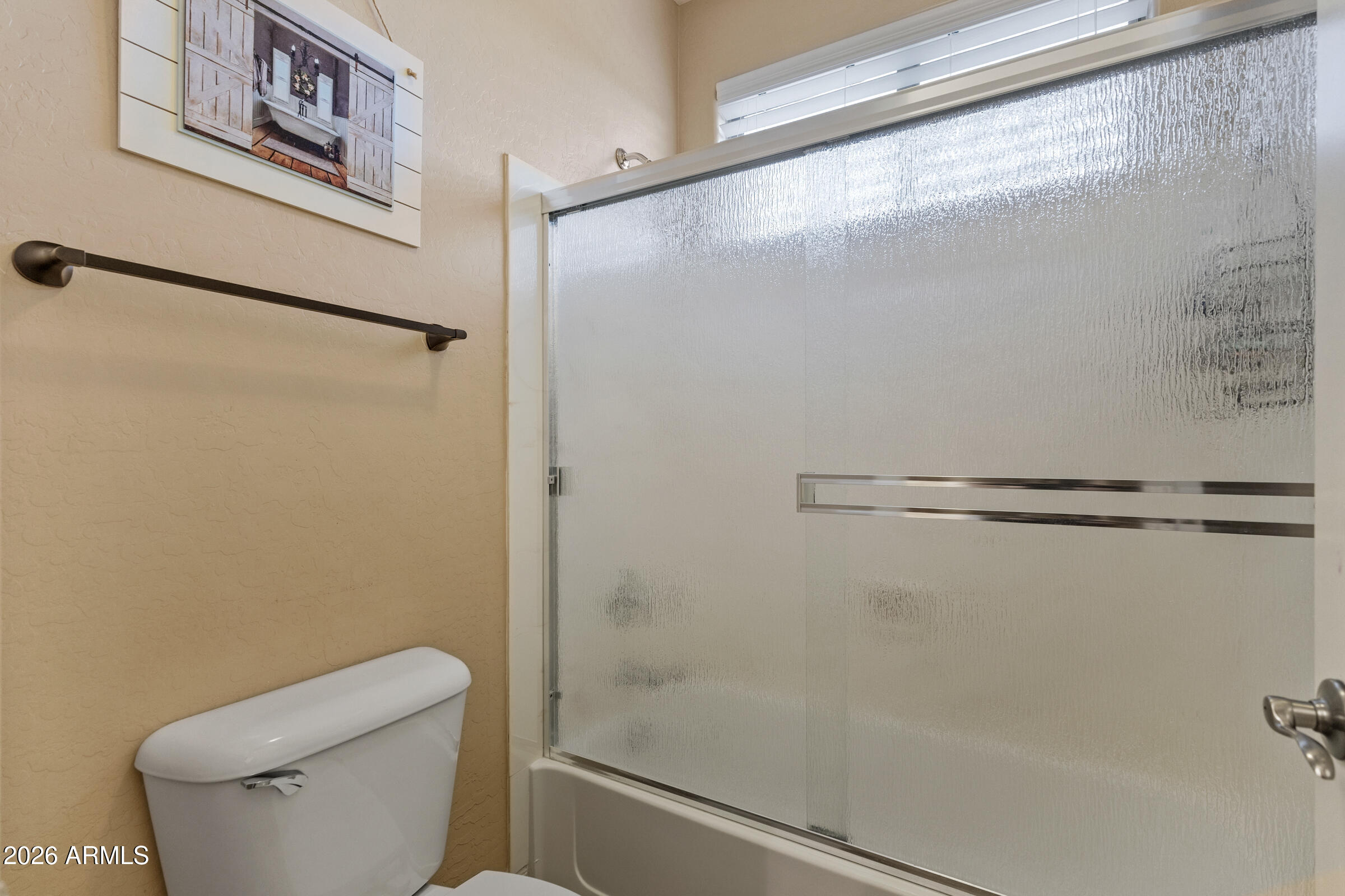 1341 East Macaw Court Gilbert, AZ 85297 - Photo 35 of 49 a bathroom with a shower and toilet