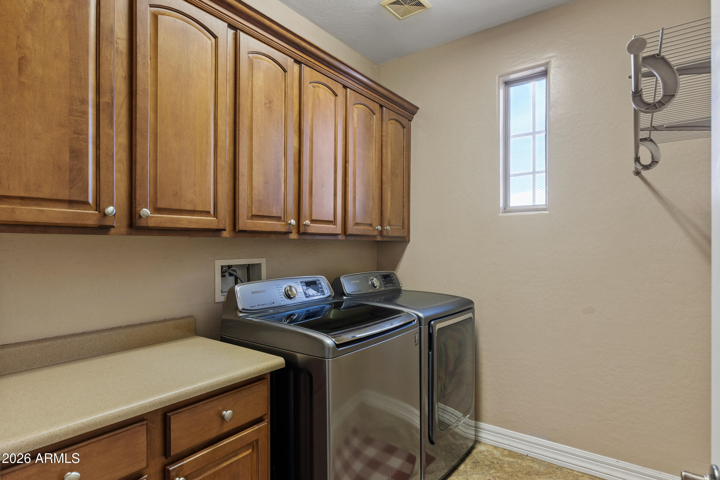 1341 East Macaw Court Gilbert, AZ 85297 - Photo 36 of 49 a utility room with dryer and washer