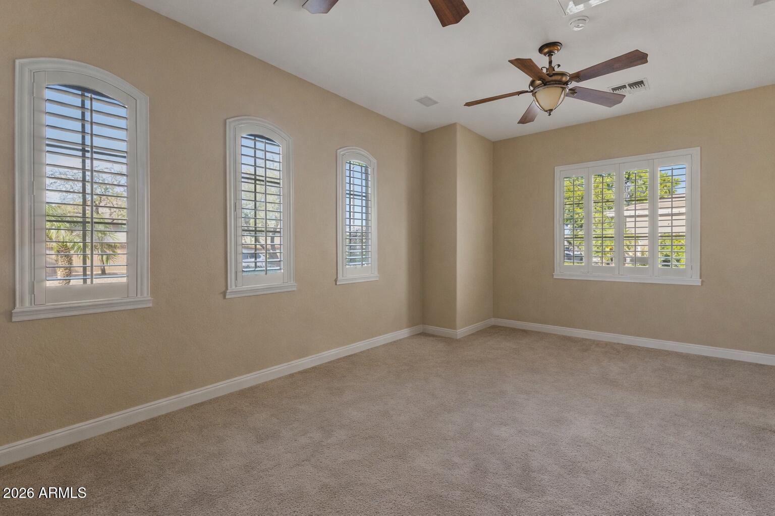 1341 East Macaw Court Gilbert, AZ 85297 - Photo 39 of 49 a view of an empty room with a window