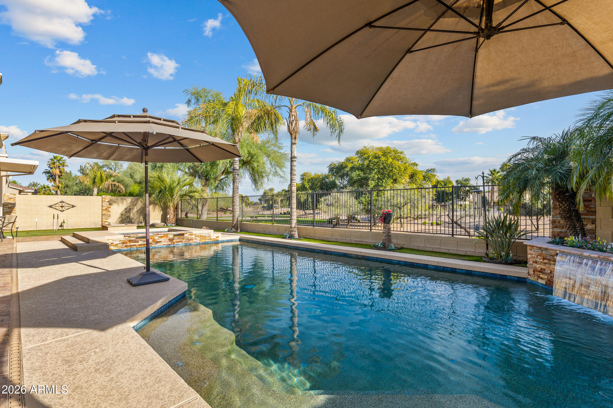 1341 East Macaw Court Gilbert, AZ 85297 - Photo 41 of 49 a view of a swimming pool with a patio