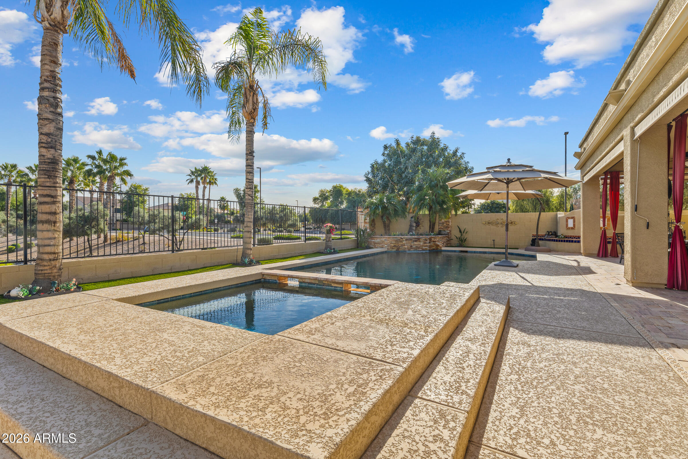 1341 East Macaw Court Gilbert, AZ 85297 - Photo 44 of 49 a view of a swimming pool with a patio