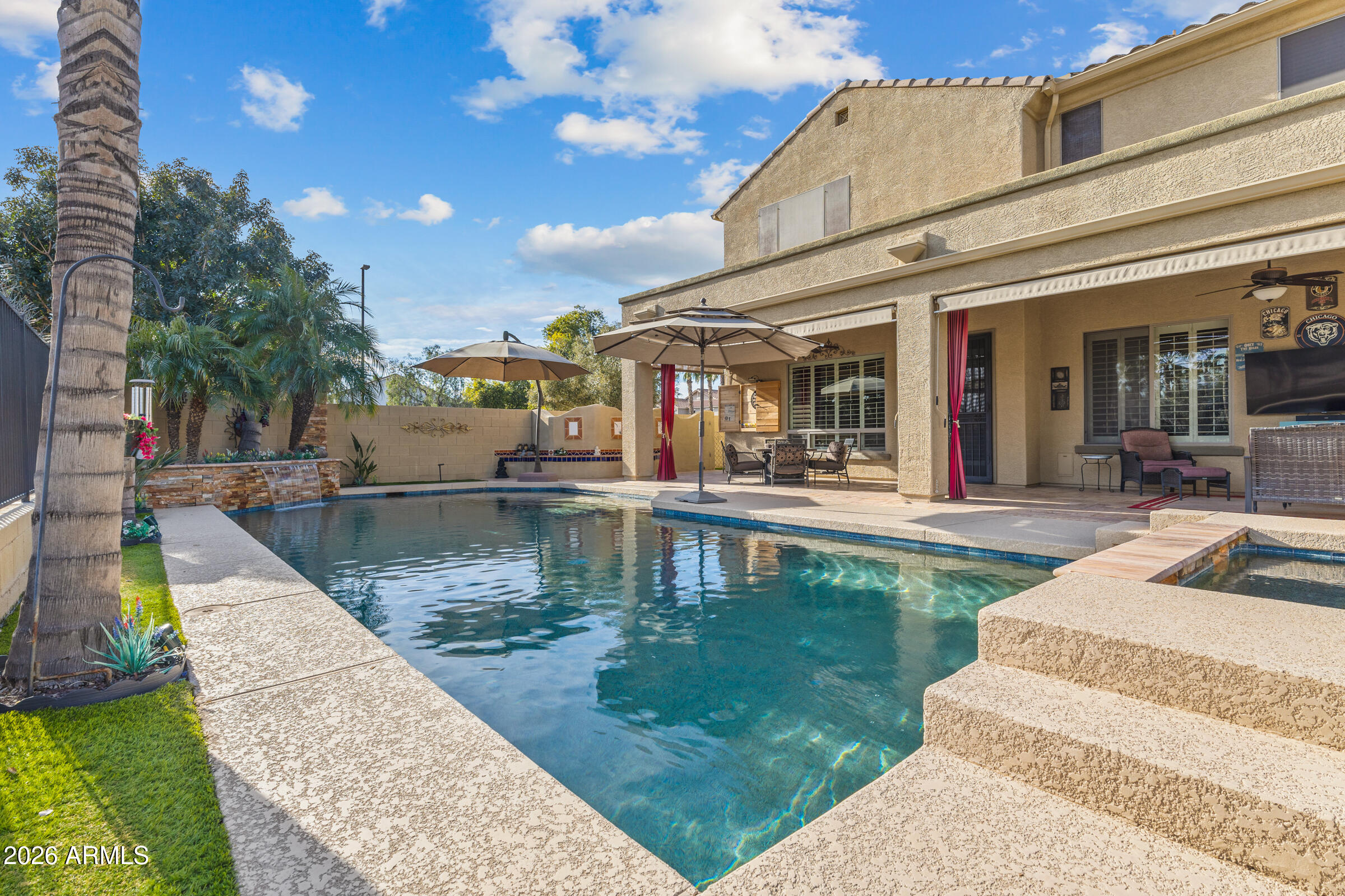 1341 East Macaw Court Gilbert, AZ 85297 - Photo 45 of 49 a view of a swimming pool with sitting area