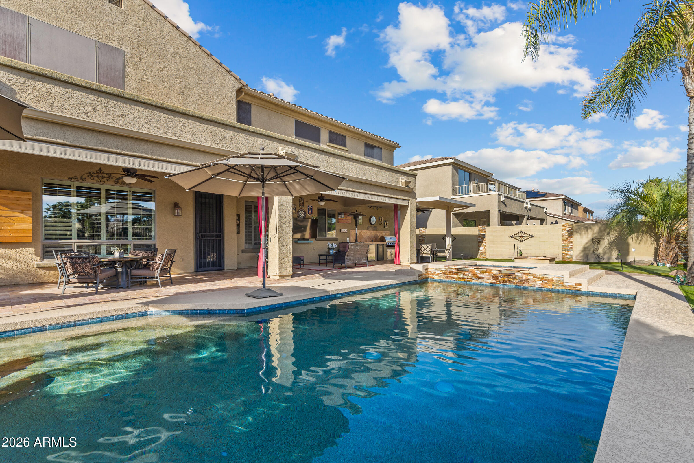 1341 East Macaw Court Gilbert, AZ 85297 - Photo 46 of 49 a view of a house with swimming pool and sitting area