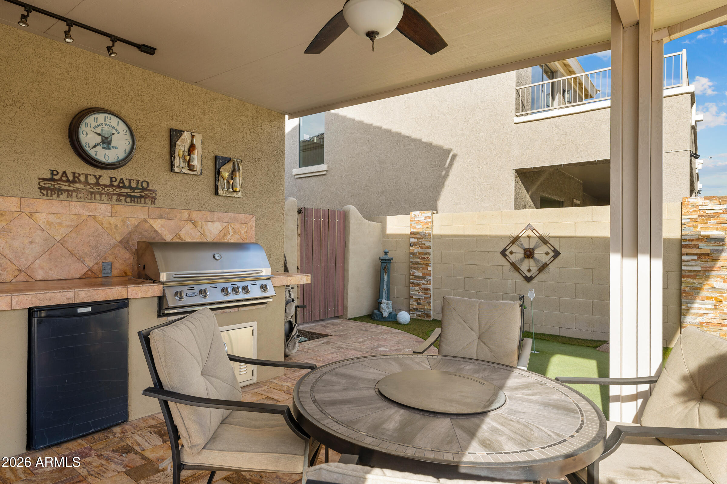 1341 East Macaw Court Gilbert, AZ 85297 - Photo 47 of 49 a kitchen with a stove and a table