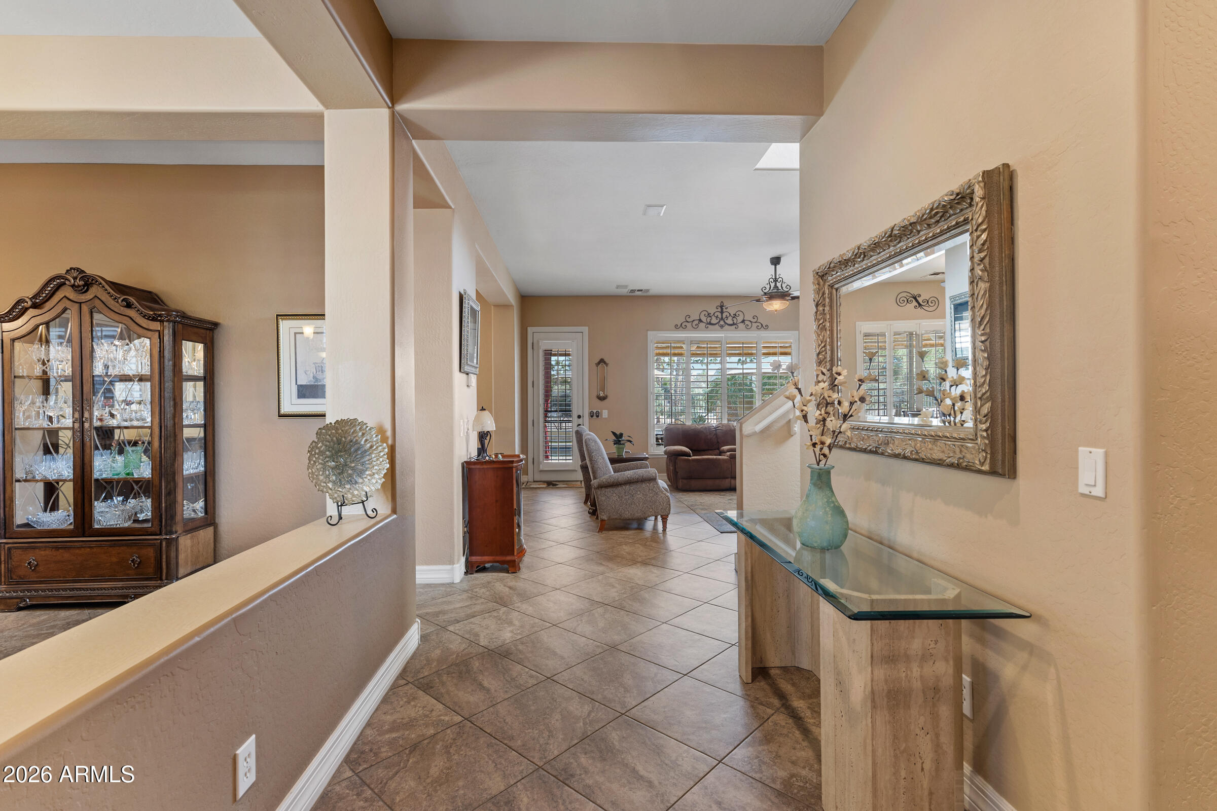 1341 East Macaw Court Gilbert, AZ 85297 - Photo 6 of 49 a living room with furniture and large windows