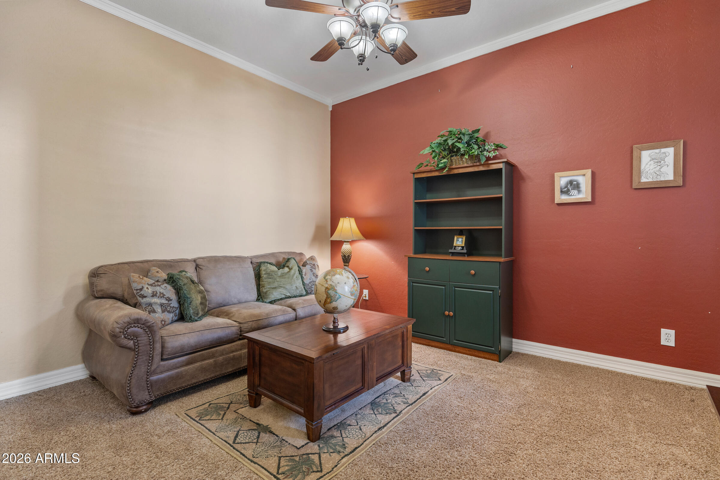 1341 East Macaw Court Gilbert, AZ 85297 - Photo 7 of 49 a living room with furniture and a chandelier