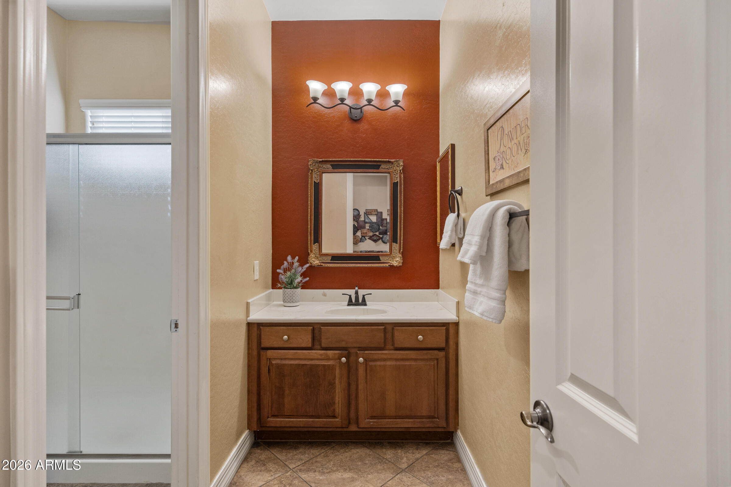 1341 East Macaw Court Gilbert, AZ 85297 - Photo 8 of 49 a bathroom with a double vanity sink and a mirror