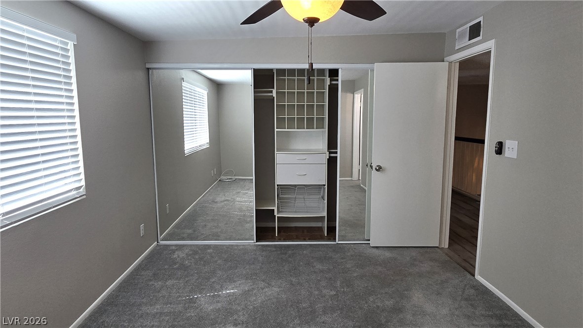 3849 Reflection Way Las Vegas, NV 89147 - Photo 21 of 25 This bedroom offers ample storage with mirrored closet doors and integrated shelving.