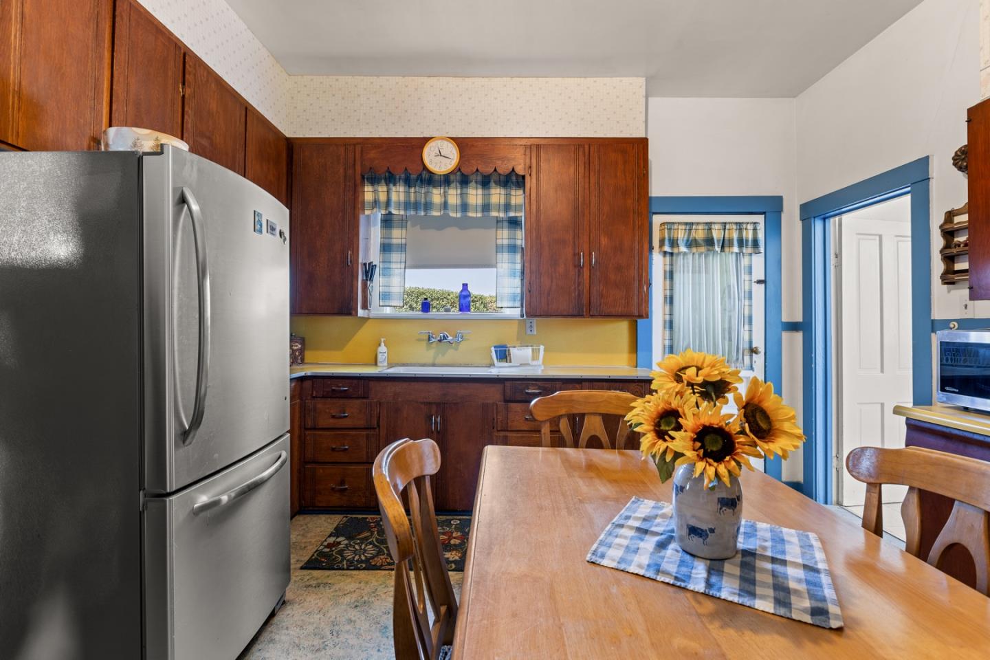 14550 Valley Ford Estero Road Valley Ford, CA 94972 - Photo 29 of 41 a kitchen with stainless steel appliances granite countertop a refrigerator a sink a dining table and chairs