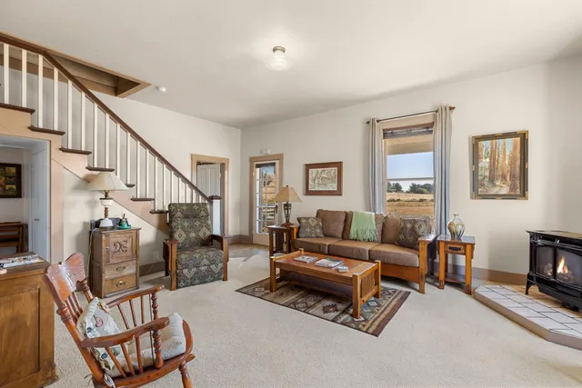a living room with furniture and a rug